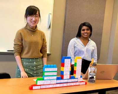 AFS students present their "building block" logic model during Program Development and Administration