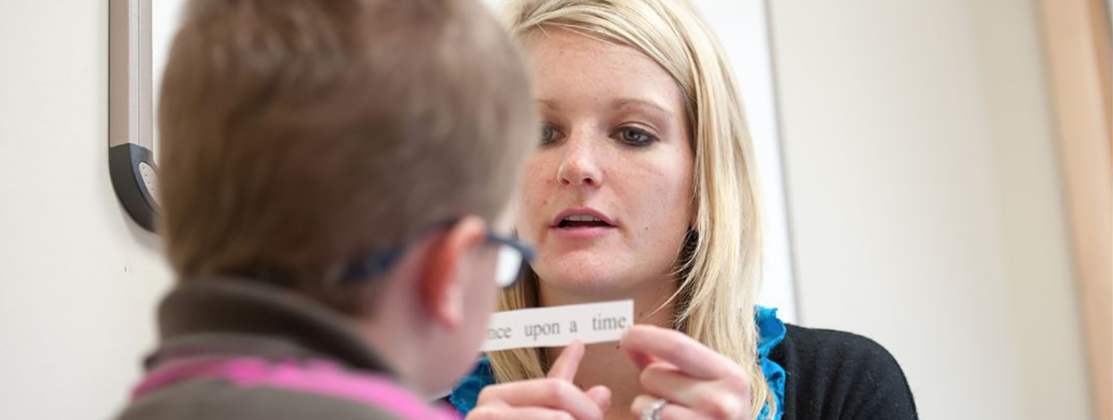 Student working with a child