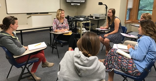 Clinic director interacting with students