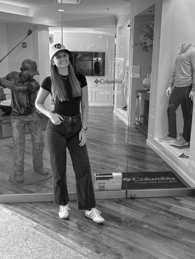 Teegan Farrell Posing next to the entrance sign to OCS