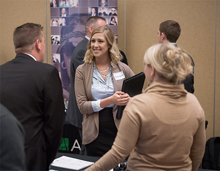 Student speaking with employers