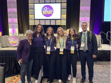 The AFCPE team between Dr. Kate Mielitz and Dr. Blake Gray at the conference