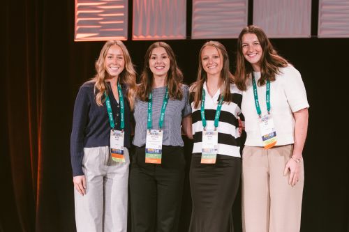 Katie Dinkel, Katelyn Wilson, Alivia Kaiser, and Leah Meek on stage accepting first place at the AFCPE competition