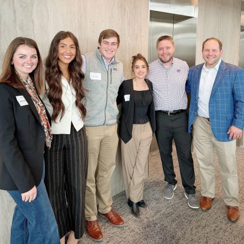 The four students attending the FPA KC Mini-Gatherings positioned with Dr. Martin Seay and Dr. Derek Lawson with neutral wall background.