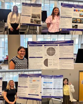 Students standing with their RSCAD posters in Justin Halls Hoffman Lounge