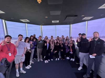 HM 361 Students posing as a group during a simulation activity