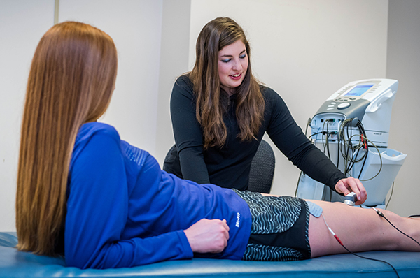 Athletic Trainer at table with patient