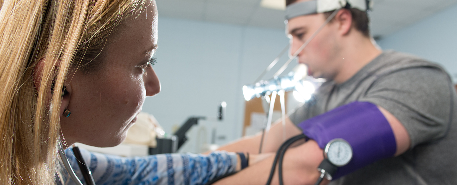 Students in lab measuring vitals