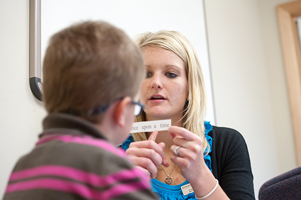 Student working with child