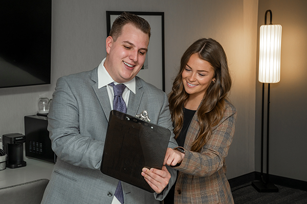 Hotel employees review booking