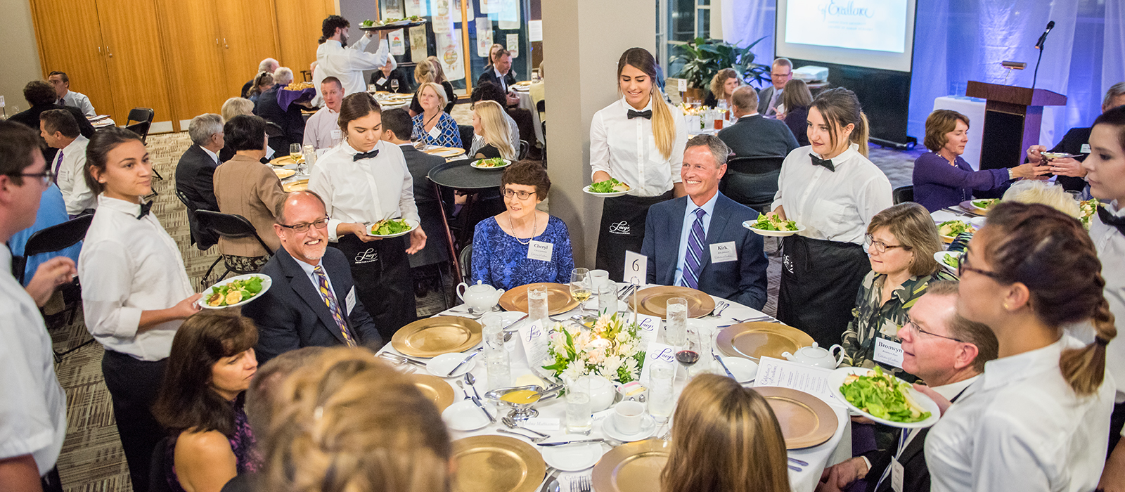 Students serving at a banquet