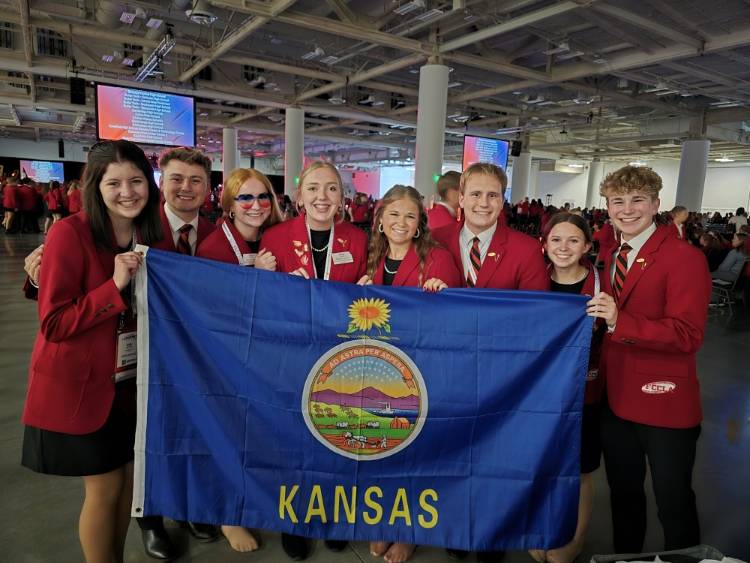 State officers with the NLC flag