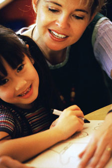 Photo of a person working with a child
