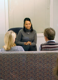 Photo of a couple meeting with a counselor