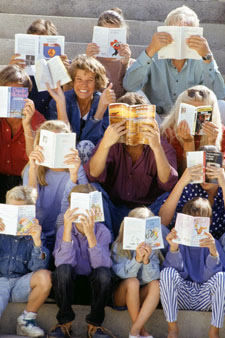 Photo of a woman working with a group of students