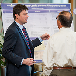 Student presenting a poster